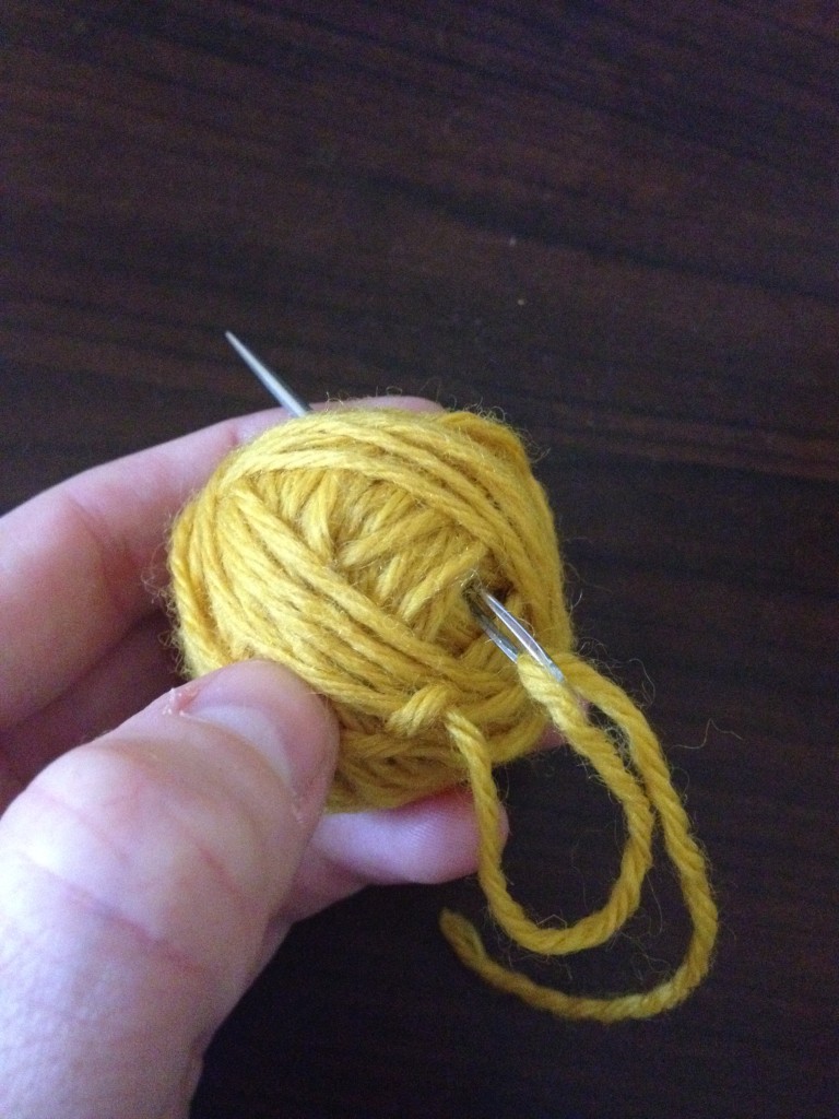Threaded yarn ball